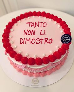 a red and white cake with writing on the top that says tanto non li dimostro