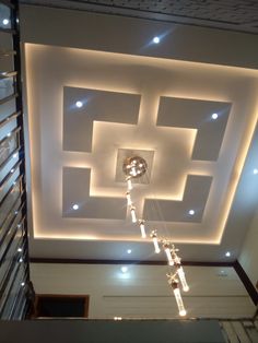 an overhead view of a ceiling with lights in the center and square shapes on it