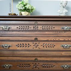 an old dresser with decorative knobs on it