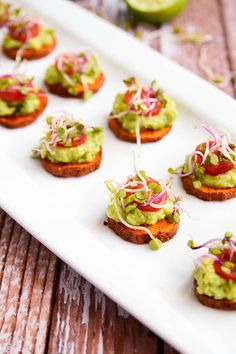 small appetizers with guacamole and red onion sprinkles