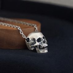 Embrace the dark allure of gothic fashion with our Sterling Silver Skull Necklace for Men. This meticulously crafted piece of jewelry is perfect for those who appreciate the macabre and the mysterious. Ideal as a Halloween gift or for everyday wear, this pendant is a striking addition to any collection. * N E C K L A C E ∙ D E T A I L S * › 1x Sterling Silver Skull Necklace › Pendant Sizes: - Small: 9*10mm - Large: 14*15mm  › Chain Length: 55cm › Material: Premium Sterling Silver › Hypoallergeni Gothic Mode, Skull Accessories, Gothic Elegance, Gothic Pendant, Skull Pendant Necklace, Bold Accessories, Skull Jewelry, Skull Necklace, Skull Pendant