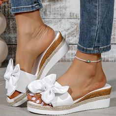 variants2 Round Toe Sandals With Bow In Synthetic Material, Synthetic Sandals With Bow And Round Toe, Slip-on Round Toe Wedge Sandals For Beach, Spring Sandals With Bow And Round Toe, Slip-on Synthetic Sandals With Bow Detail, Synthetic Slip-on Sandals With Bow, Slip-on Synthetic Wedge Sandals With Round Toe, Slip-on Synthetic Wedge Sandals For Beach, Flat Slip-on Wedge Sandals For Beach