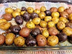 roasted herb baby potatoes in a glass dish on a towel with the words roasted herb baby potatoes