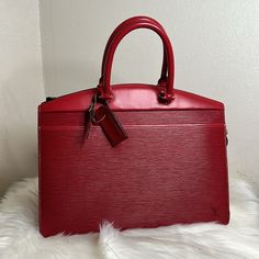 Pre-Loved Louis Vuitton Epi Riviera Hand Bag Red Color Multiple Interior Pockets Scuffing In The Outer Edges Slightly Sticky In The Interior Might Have Tiny Scratches In The Outer 14x11 Inches #65 Louis Vuitton Bags, Hand Bag, Authentic Louis Vuitton, Louis Vuitton Bag, Red Color, Bag Lady, Louis Vuitton, Handbags, Red