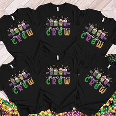 four t - shirts with the words happy new year and three owls on them, surrounded by confetti