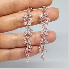 ❤️Best seller These diamond look, long and dainty bridal earrings are made with clear, round and marquise cut Cubic Zirconia chandelier pendants in Rose gold plated brass settings. The earrings dangle from high quality silver plated ear posts with clear CZ studs. The earrings have delicate sparkle and shine and would be a perfect accessory to add glamor and elegance to your bridal style! (High quality plating, Anti tarnish, Nickel free). * These chandelier earrings measure about 60mm / almost 2. Statement Earrings Wedding Rose Gold, Luxury Rose Gold Round Bridal Earrings, Cheap Rose Gold Dangle Earrings, Rose Gold Wedding Accessories Brides, Luxury Rose Gold Jewelry With Matching Earrings, Cheap Gold Bridal Earrings For Festive Occasion, Luxury Rose Gold Diamond Wedding Earrings, Long Rose Gold Earrings, Luxury Rose Gold Jewelry For Reception