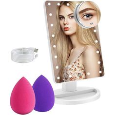 there is a makeup mirror and two sponges next to it