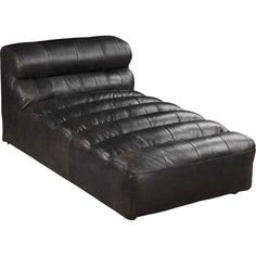 a black leather futon bed with the headboard turned back and foot rest down