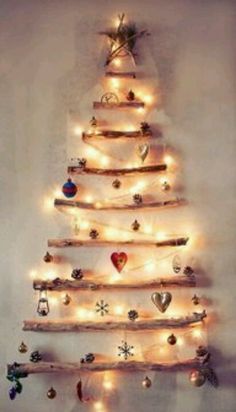 a wooden christmas tree with lights on it