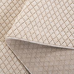 the textured fabric is beige and white