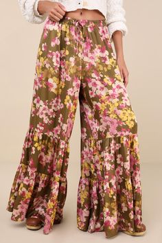 Weekends are for slow evenings and flawless looks like the Lulus Sweeter Sunsets Olive Green Floral Satin Tiered Wide-Leg Pants! Sleek woven satin, with a pink, ivory, and yellow-hued floral print throughout, shapes these breezy pants with a high-rise fit and an elasticized waistband with decorative drawstring ties. The wide pant legs boast a tiered silhouette before ending at full-length hems. Fit: This garment fits true to size. Length: Floor length. Size medium Inseam: 31.00 Front Rise: 13.50 Tiered Pants, Pink Ivory, Wide Pants, Leg Pants, Wide Leg Pants, Floor Length, Olive Green, Full Length, Wide Leg