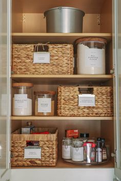 the pantry shelves are filled with baskets and containers