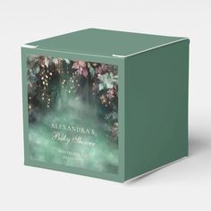 a green box with an image of fireworks and flowers on the front, along with text that reads alexandria baby shower