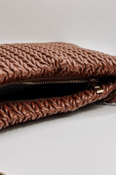 Elevate your everyday style with the Shelby Brown Faux-Leather Purse. Crafted from rich, textured dark brown faux leather, this purse offers a luxurious look without compromising on ethics. The two gold chain straps add a touch of glam, making it easy to wear over the shoulder or carry by hand. Featuring a secure gold zipper closure and an inner zippered pocket for your essentials, the Shelby purse is both practical and stylish, perfect for day-to-night transitions. Textured dark brown faux leat Textured Leather Brown Clutch Shoulder Bag, Brown Clutch With Braided Handles For Everyday Use, Chic Brown Clutch With Chain Strap, Trendy Brown Clutch For Travel, Brown Crossbody Clutch With Chain Strap, Chic Brown Shoulder Bag With Chain Strap, Formal Brown Shoulder Bag With Braided Handles, Brown Shoulder Bag With Chain Strap, Brown Shoulder Bag With Chain Strap As Fashion Accessory