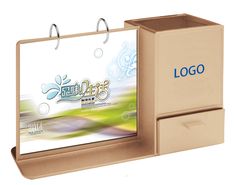 a cardboard box with a logo on the front and bottom, attached to a clipboard holder