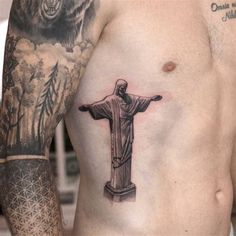 a man's chest with a tattoo of jesus and a bear on it in front of him