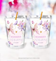 two frosted cups with butterflies and flowers on them, one is for madison's 1st birthday