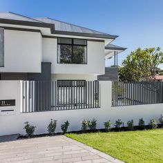 a white house with black trim and windows