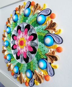 an artistic paper art work made with buttons