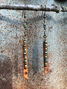 These simplistic genuine leather and seed beads earrings are completely handmade from the leather charm to the dangle charms. These statement earrings can be worn with an everyday casual look or for a special occasion outfit. Beaded Chandelier Earrings, Genuine Leather Bracelet, Beaded Chandelier, Special Occasion Outfits, Beaded Dangle Earrings, Dangle Charms, Casual Look, Handmade Boho, Seed Bead Earrings