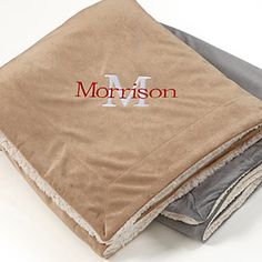 a pile of folded towels with the word'm'on it and an advertise