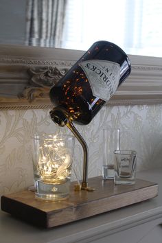 Lamps From Bottles, Gin Bottle Lamp Diy, Hendricks Gin Bottle Ideas, Upcycling Bottles, Bottle Lamp Ideas, Glass Bottle Lamp, Liquor Bottle Lights, Diy Bottle Lamp, Liquor Bottle Lamp