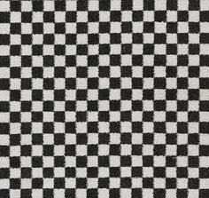 a black and white checkered rug is shown