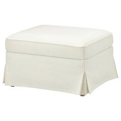 a white ottoman with a pleaed skirt