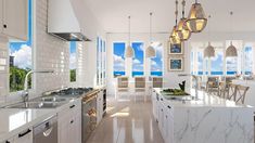 a large kitchen with marble counter tops and white cabinets