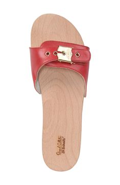 A smooth, natural beechwood footbed extends the vintage appeal of a handcrafted slide sandal finished with a buckle strap and nail-head rivets. 1 1/2" heel; 3/4" platform (size 8) Adjustable strap with buckle closure Contoured footbed for comfort and support Leather or textile upper and lining/synthetic sole Imported With the purchase of this shoe, Dr. Scholl’s will donate one tree to the nonprofit Trees for the Future, which provides opportunities for impoverished families to learn sustainable Dr. Scholl's, Black 13, Platform Slides, One Tree, Sandal Women, Rivets, Leather Working, The Vintage, Slide Sandals