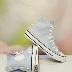 Brand New In Box Style #07216c Cloudy Daze/ White Add A Feminine Update To Your Sneaker Collection With The New Women's Blue Chuck Taylor All Star Flower Eyelet High Top Sneakers From Converse. Boasting Flower-Shaped Eyelets, A Durable Canvas Upper, And A High-Top Design, These Sneakers Seamlessly Blend Classic Style With Feminine Details For A Chic And Comfortable Statement. Canvas Upper High-Top Silhouette Lace-Up Front Closure Flower-Shaped Eyelets All Star Branding Woven Tongue Label Contras Light Blue High-top Sneakers For Spring, Blue Lace-up Canvas Shoes For Spring, Spring Converse Canvas Shoes With Laces, Trendy Converse Canvas Shoes For Spring, Trendy Light Blue Sneakers For Spring, Trendy Spring Converse Canvas Shoes, Light Blue Spring Sneakers, Light Blue Lace-up Sneakers For Summer, Light Blue Lace-up Sneakers For Spring