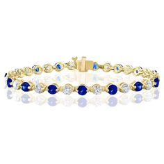 A stunning bracelet set with 18 stunning Blue sapphires weighing 3.18 carat total. Alternating these Blue Sapphires are 18 sparkling round diamonds weighing 2.88 carats in total. Set in polished 14k yellow gold. Double lock mechanism for maximum security. A simple yet dazzling piece. All diamonds are GH color SI1 Clarity. Style is available in different price ranges. Prices are based on your selection. Don't hesitate to get in touch with us for more information. Sapphire Tennis Bracelet With 17 Jewels, Sapphire Diamond Tennis Bracelet With Round Shape, Sapphire Diamond Tennis Bracelet With Round Cut, Sapphire Tennis Bracelet With Round Diamonds, Blue Round Tennis Bracelet With Prong Setting, Blue Tennis Bracelet With Prong Setting, Sapphire Brilliant Cut Tennis Bracelet, Blue Sapphire Diamond Round Bracelet, Blue Sapphire Round Tennis Bracelet