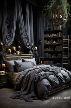 a bedroom with black walls and wooden flooring is lit by candle lights in the dark