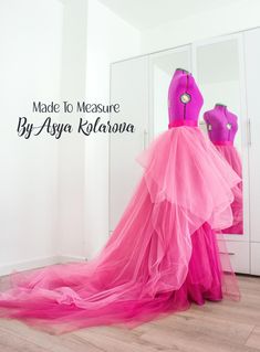 a woman's pink dress is shown in front of a mirror with the words made to measure