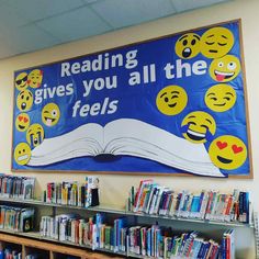 a sign that says reading gives you all the feels in front of bookshelves