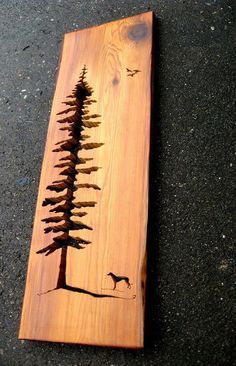 a piece of wood that has some trees on it