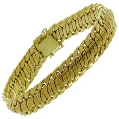 This classic vintage bracelet features an elegant braided link design crafted in multi-textured 18k yellow gold. Made in United States circa 1970s. Measurements: 0.47" (12mm) width, 7.5" (19.5cm) length. Mens Bracelet Gold Indian, Mens Bracelet Gold, Mens Bracelet Gold Jewelry, Gold Flower Bracelet, Yellow Gold Mens Rings, Vintage Gold Necklace, Bling Ideas, Flexible Bracelet, Dainty Gold Jewelry