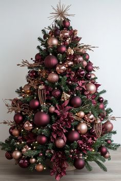 a christmas tree with red and gold ornaments