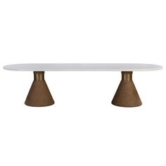 a white table with two brown cones on it