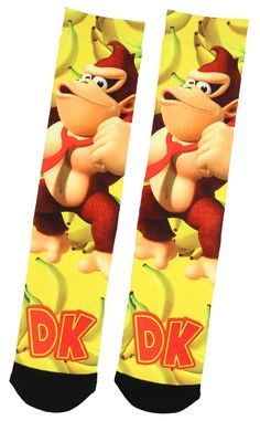 PRICES MAY VARY. 100% Officially Licensed Nintendo Product Detailed Sublimated Design Of Donkey Kong And Bananas Sublimated Super Soft And Stretchy Tri-Fabric Blend With Thicker Padded Toe Cap Bright Vivid Color (Sock Size 10-13), Mens Shoe Size 7-12 Approx Women's Shoe Size (6-13) And Can Be Worn By Most Older Youth Or Teens These 100% Officially Licensed Nintendo Super Mario sublimated socks features an awesome all over design of some of the most popular character from the Nintendo/Super Mario Sublimated Socks, Sock Store, Super Mario World, Sock Drawer, Donkey Kong, Socks For Men, Crazy Socks, Colorful Socks, Vivid Color