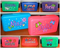 several different colored lunch boxes with name labels on the front and side, all decorated in cartoon characters