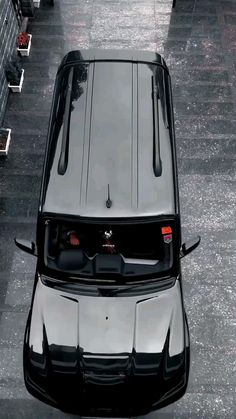 an aerial view of a car parked on the street