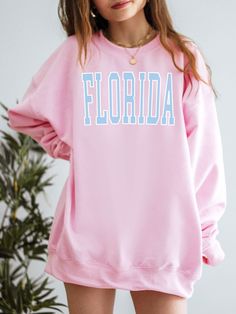 ♥ Hello and Welcome to Meaningful Tees Shop! ♥ Get ready to hit the beach (or cuddle up at home) with this Cute and Comfy Florida Sweatshirt! ♥ Printed on the most popular Unisex Sweatshirt, the Gildan 18000 is 50% Cotton / 50% Poly. The soft fleece lining makes it super Comfy and is sure to become your new favorite! ♥ All of our items are made to order with care for each customer : ) ♥ Please allow 3-7 BUSINESS days for your item to be created PLUS shipping time via USPS ♥ This Unisex Sweatshir Malibu Sweatshirt, Florida Sweatshirt, Preppy Sweatshirts, California Sweatshirt, Beach Sweatshirt, Sweatshirt Trendy, Nurse Sweatshirt, Preppy Aesthetic, Sweatshirt Women