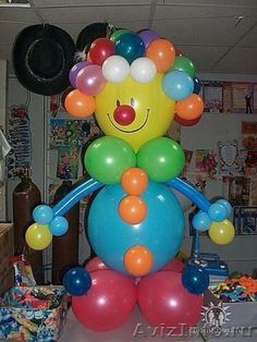 the balloon clown is sitting on top of the table