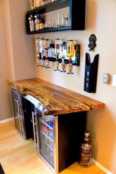 a wooden counter top sitting in the middle of a room next to shelves filled with liquor