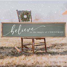 a wooden sign that says believe in the magic of christmas sitting on top of a rocking chair