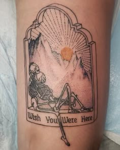 a person with a tattoo on their leg that says wish you were here