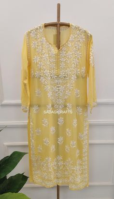 DESCRIPTION ▪ Fabric: Modal ▪ Sleeves: 3/4 Sleeves ▪ Style: Straight Kurti ▪ Length: 44-46 Inches ▪ Occasions: Casual Wear, Office Wear, Festive Wear ▪ Garment Care: Hand Wash Only ▪ Net Content: Only Kurti Traditional Festive Kurta With 3/4 Sleeves, Festive Traditional Kurta With 3/4 Sleeve, Traditional 3/4 Sleeve Kurta For Diwali, Long Sleeve Chikankari Embroidered Dresses For Diwali, Long Sleeve Dresses With Chikankari Embroidery For Diwali, Traditional Summer Dress With Cutdana, Spring Kurta With Chikankari Embroidery And 3/4 Sleeve, Spring Festive Kurta With Cutdana Detail, Spring Festive Kurta With Cutdana