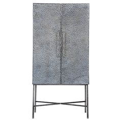 a tall metal cabinet with two doors