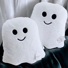 two pillows that have been made to look like ghost faces